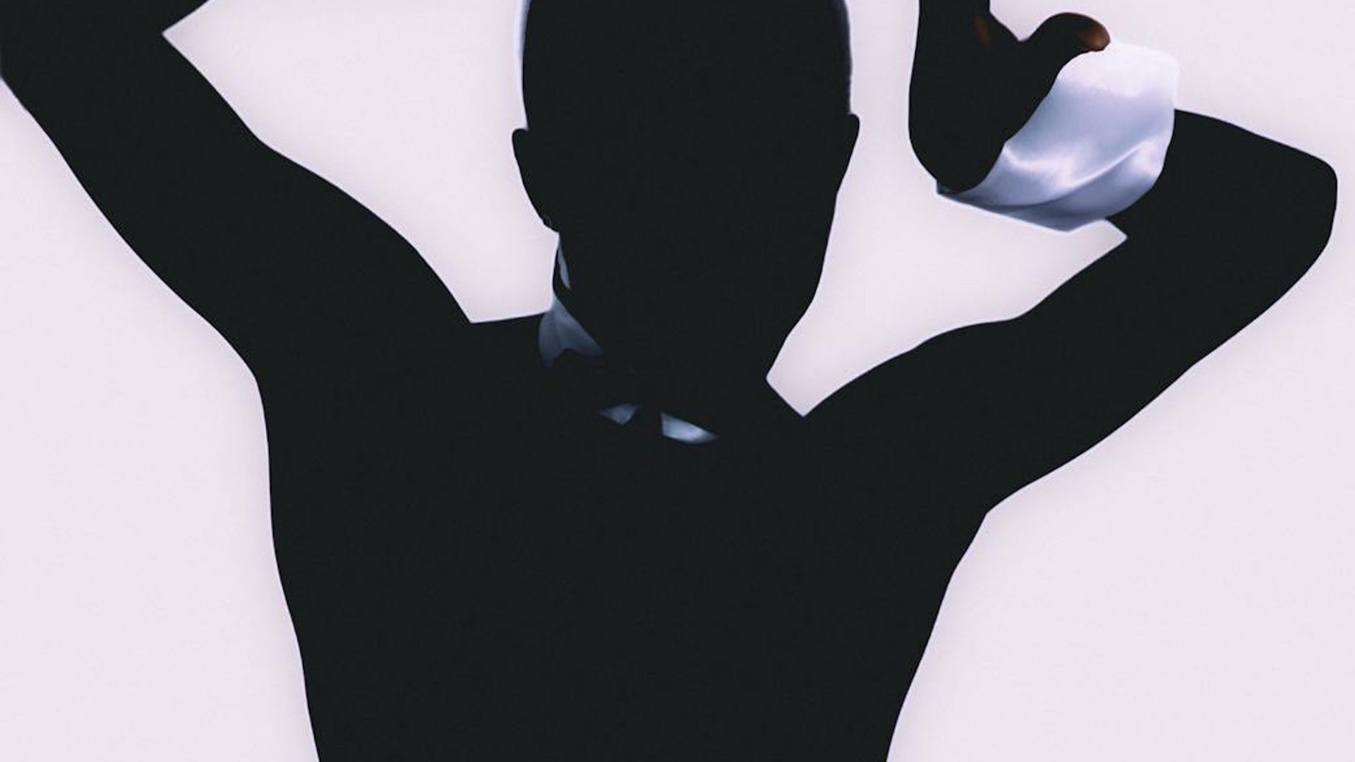 Abstract silhouette of a person in a dynamic movement pose.