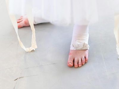 Close-up of feet finding balance on the floor.